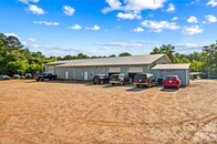 29 Car Garage in a Commercial Setting and it has a House that you Can Live-in!